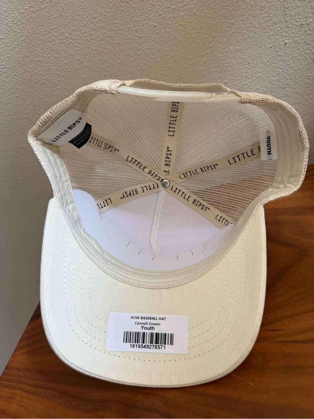 Little Bipsy Cream Trucker Hat with Black Bow